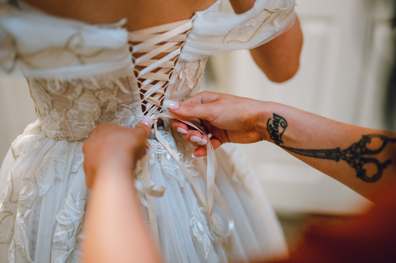 Putting on a wedding dress